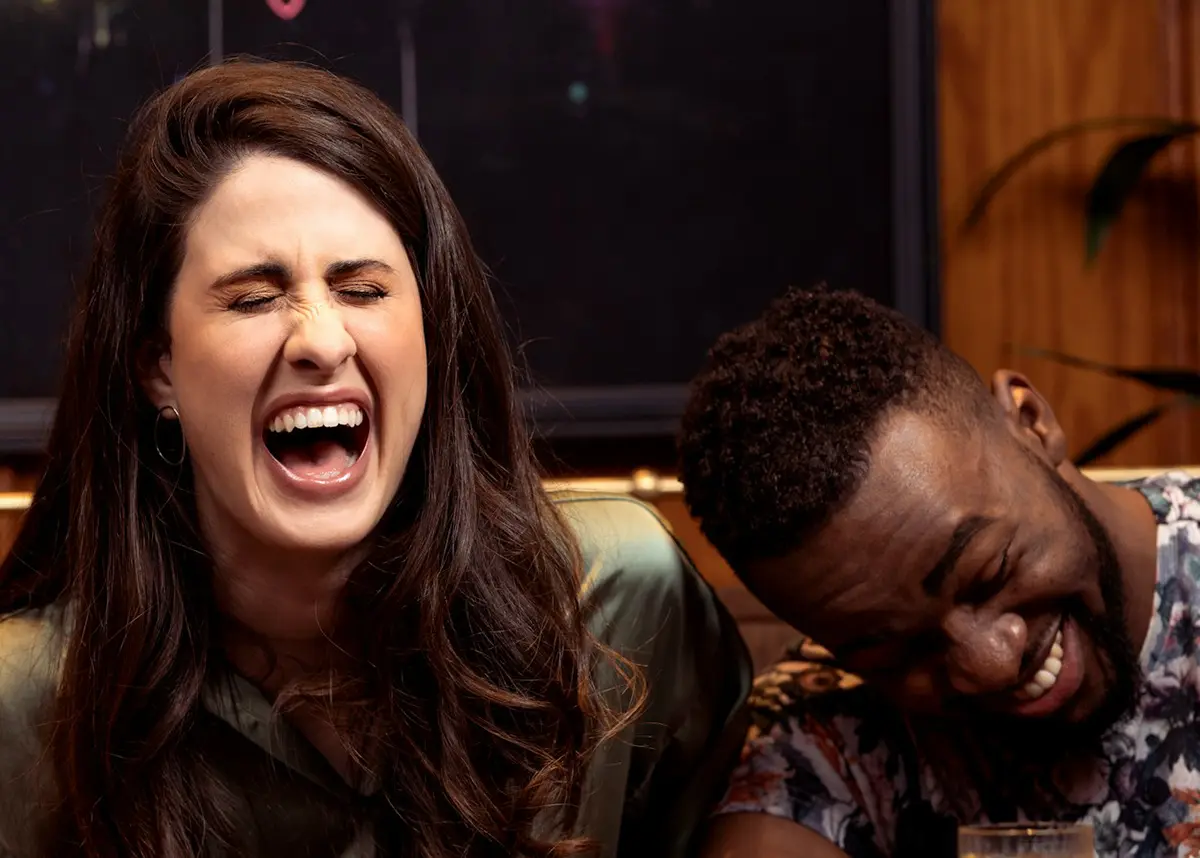 Two people laughing together