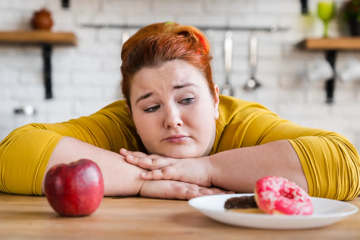 Woman deciding between foods